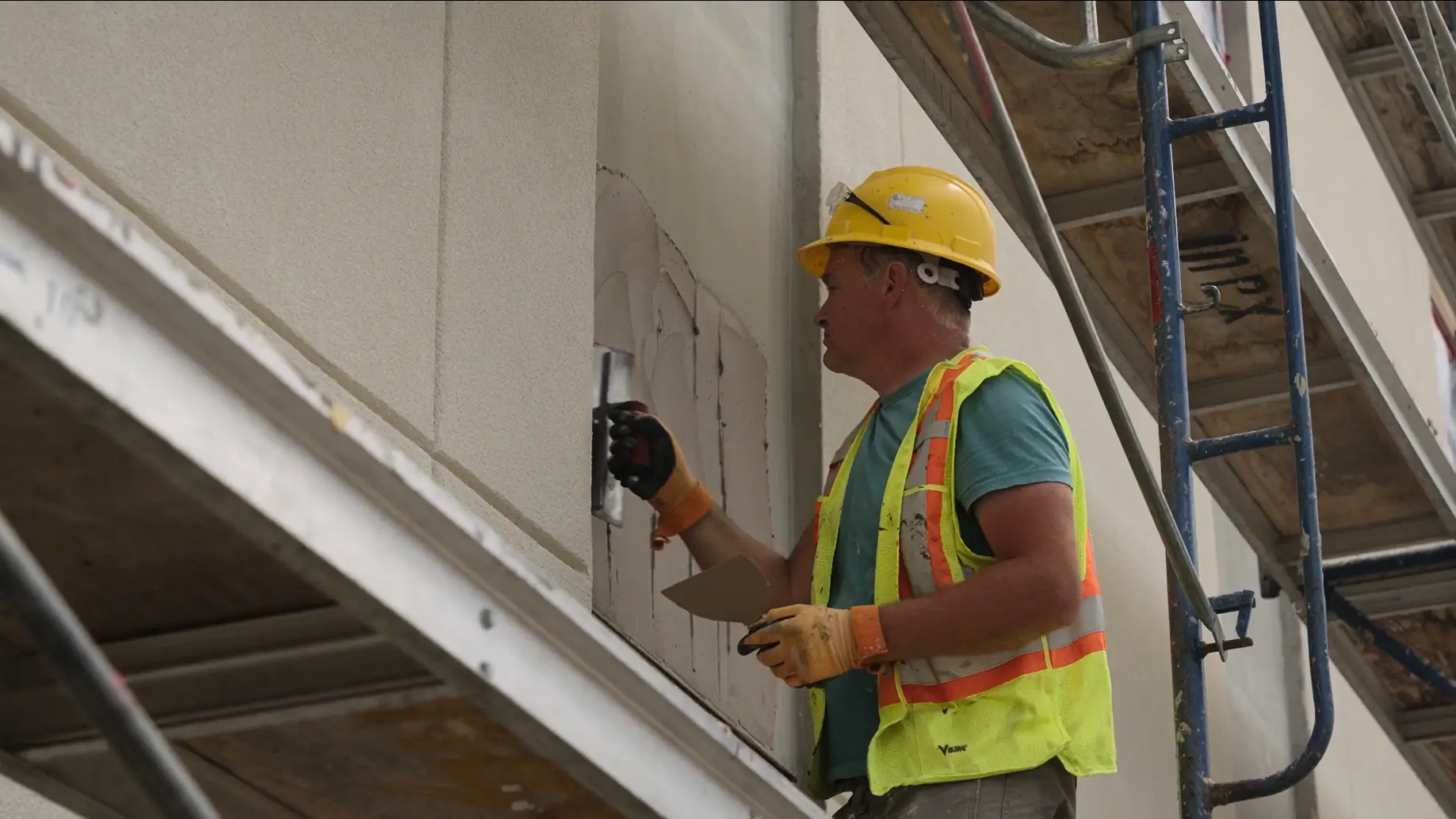 IN-EX tradesperson installing EIFS on a commercial project