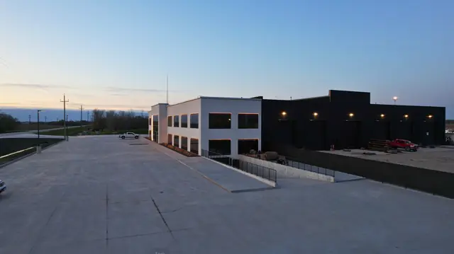Fast Bro building and parking area at night